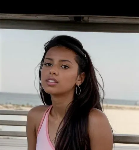 The Moroccan girl sits on a bench and looks at the sea.  She wears sneakers, pink tights and a white sports bra.  There are more people walking around the promenade.,thahane,paulini,matangi,angolan,na