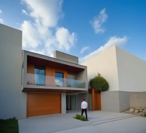 In the heart of the urban jungle, a modern modern house with rich, textured lines and geometric shapes sits proudly against the backdrop of a deserted urban landscape. The house is made of concrete an