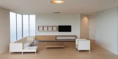 hay un televisor en la pared del fonto y los muebles aereos son de madera,an empty, modern living room with a flat screen tv mounted to the wall,modern minimalist lounge,anastassiades,interior modern 