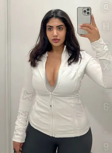 a woman with her cellphone taking a po of herself in a mirror,vidya,vij,thighpaulsandra,hypermastus,hindiyah,kamini