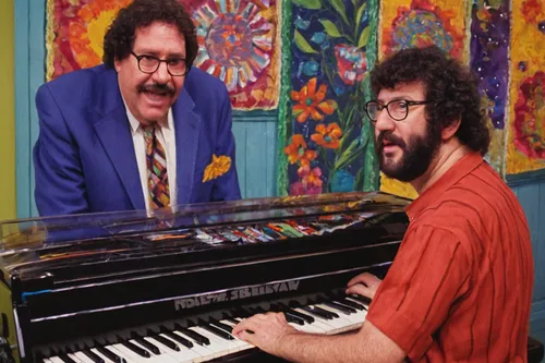 Incorporate Gene Belcher's musical talent in a heartwarming scene where he plays the keyboard for a local charity event.,jazz pianist,piano player,electric piano,ulpiano,keyboard player,pianet,synthes