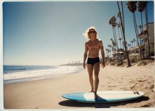 Southern California, sunny day, clear blue sky, palm trees swaying gently, sandy beach, calm waves, seagulls flying overhead, a surfer riding the waves, athletic build, blonde hair, sunglasses, surfbo