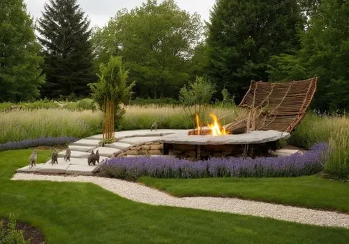 ประติมากรรมในสวนสาธารณะ,the fire pit is next to some purple flowers,firepit,fire pit,the eternal flame,fire bowl,fire place,outdoor furniture,Photography,General,Realistic