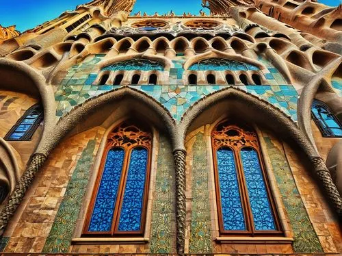 Gaudi-inspired architecture, Barcelona, Spain, intricate stonework, vibrant colorful tiles, ornate ironwork, grandiose entrance, sweeping arches, Gothic Revival style, Sagrada Familia influence, moder