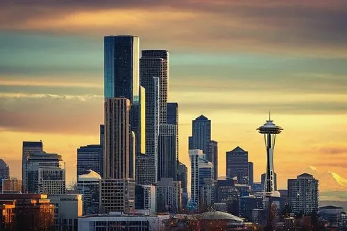 Seattle cityscape, modern skyscraper, glass and steel structure, sleek lines, geometric shapes, urban landscape, Space Needle in the distance, Mount Rainier backdrop, cloudy sky, afternoon light, warm