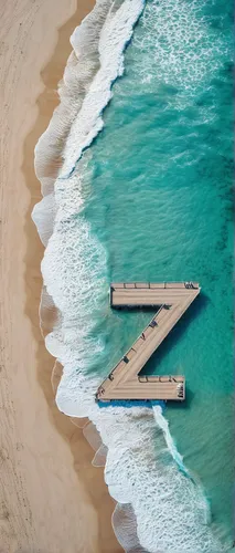 Describe a serene beach with the shape of a massive letter Z on the shoreline.,wooden pier,shipwreck beach,sunken boat,beach furniture,boat dock,beach chairs,fiji,aerial view of beach,waikiki beach,pi