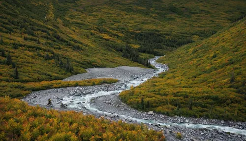 Tyler McCaul hikes with his bike in the Tatshenshini-Alsek Provincial Park in British Columbia, Canada on September 3, 2016.,denali national park,alaska,kamchatka,tanana river,the chubu sangaku nation