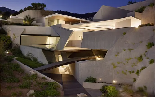 use origin shape.
location - Hollywood hills CA.
private residential building.
waterfall in the middle of hill
,dunes house,stucco wall,modern architecture,cliff dwelling,cubic house,exposed concrete,