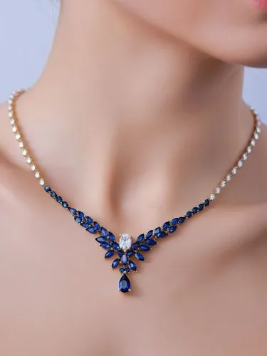 Jewelry necklace with diamond marquise stones, teardrop sapphire in the center,a blue necklace with pearls is worn with pearls,tanzanite,mikimoto,diamond pendant,necklace with winged heart,sapphires,n