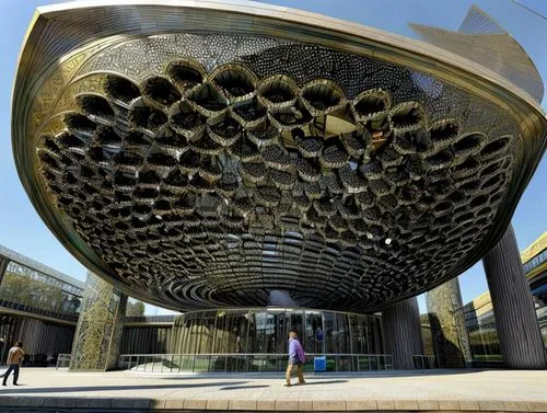 the dubai mall entrance,honeycomb structure,soumaya museum,futuristic art museum,autostadt wolfsburg,steel sculpture,public art,futuristic architecture,building honeycomb,largest hotel in dubai,volgograd,the hive,solar cell base,iranian architecture,ozeaneum,outdoor structure,mercedes-benz museum,baku eye,costanera center,stargate