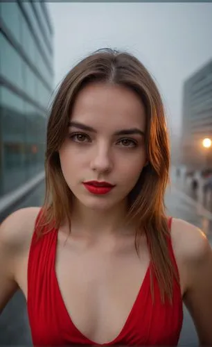 a portrait half body of caucasian girl 22 years old, brown hair, brown eyes, red lips, wearing a red dress stand up in a street of Madrid City close to metro station at sunset in a rainy day in4k,a wo