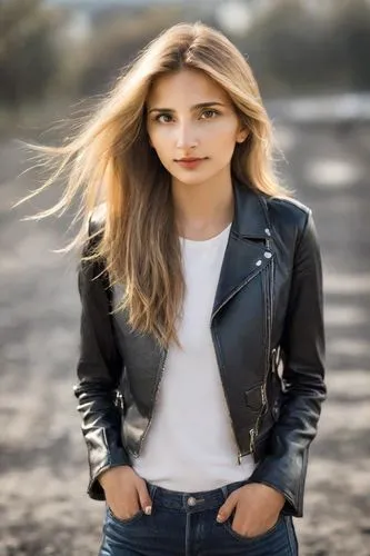 a realistic photo of a young blonde Texan girl in extremely thin and soft jeans and black leather jacket, long hair, highly realistic, eye-catching detail, sharp focus, masterpiece, 8k, film grain, hi