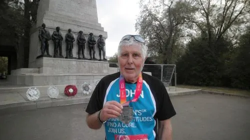 an old man is standing by some statues,marathoner,commissaire,vimy,glasnevin,locog,dimbleby,pieczenik,prostate cancer awareness,marathoners,olympic torch,duceppe,templeogue,beliveau,bloomsday,commissa