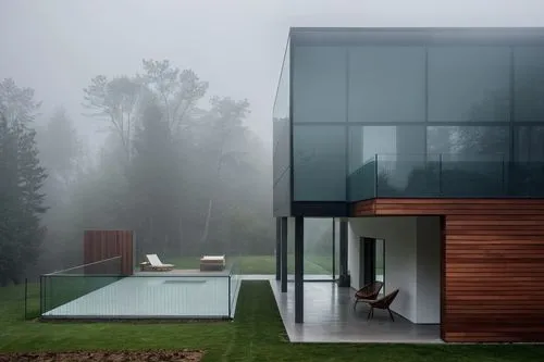 with out change object scene convert  ,a glass house in the forest with fog around,cubic house,modern house,foggy landscape,modern architecture,forest house,house in the forest,Photography,General,Rea