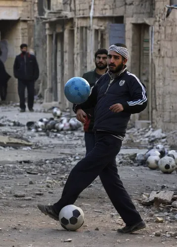 street football,soccer ball,playing football,footballer,children's soccer,syria,playing with ball,syrian,rugby ball,traditional sport,playing sports,throwing a ball,pallone,street sports,armillar ball,sports equipment,iraq,soccer kick,the ball,flying disc,Photography,Black and white photography,Black and White Photography 14