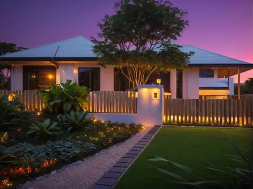 Minimal style house.
Gardening and planting tropical plants both indoors and outdooor.
It is night time.
Bedroom light for every room.
,a house with landscaping and lighting is shown,landscape designe