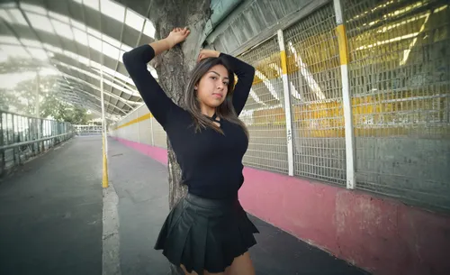 she is wearing a nice black short skirt,street dancer,hip-hop dance,street dance,the girl at the station,dance,twirling,blurred vision,video clip,woman pointing,tricking,dancing,love dance,blurred,con