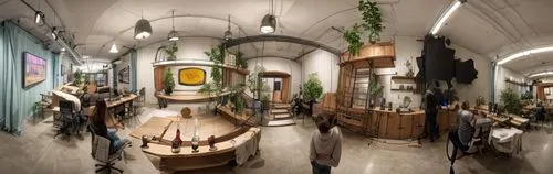 PANORAMIC VIEW OF PRESENTATION SCREEN BEHIND COUCH FROM KITCHENETTE. BUSTLING ARCHITECTURE STUDIO. PEOPLE COLLABORATING, PEOPLE PRESENTING. PEOPLE DRINKING WINE. COURTYARD. ,taproom,wine bar,liquor ba