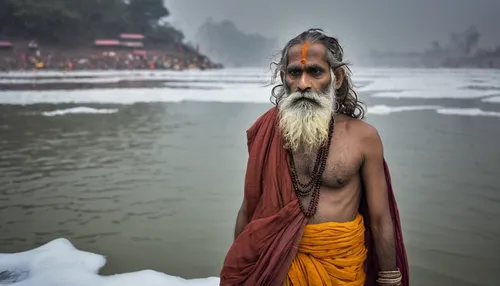 Sadhu stands stoically in the cold waters of the Ganges for almost an hour,sadhus,sadhu,indian sadhu,ganges,indian monk,ganga,rishikesh,bapu,hindu,yogi,brahminy duck,hinduism,the man in the water,budd