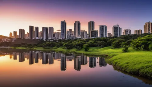 cityscape, Belo Horizonte, Brazil, panoramic view, modern skyscrapers, residential areas, lush green parks, Pampulha Lagoon, sunset glow, warm light, clear sky, urban architecture, concrete textures, 