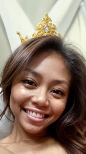 a smiling girl with her crown on her head,titleholder,tiara,rajawongse,gold crown,pandelela,ylonen