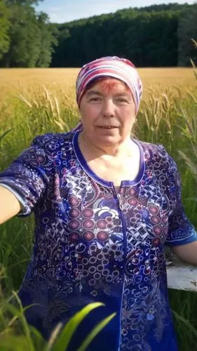 a woman standing in a field next to tall grass,barley cultivation,rigoberta,campesina,agroecology,woman of straw,rice cultivation,haudenosaunee,acadien,countrywoman,yamada's rice fields,rye in barley 