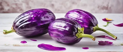 Write a poem inspired by the unique texture and taste of brinjal, evoking vivid sensory imagery.,eggplants,colorful sorbian easter eggs,sliced eggplant,eggplant,brinjal,egg plant,red onion,easter egg 