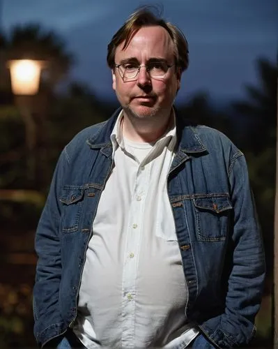 Linus Torvalds, sad, middle-aged man, bespectacled, beard, messy hair, casual wear, jeans, white shirt, sneakers, standing, looking down, hands in pockets, dimly lit background, dark colors, moody atm