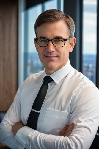 Dr. Paul Tibbitts, middle-aged man, bespectacled, short brown hair, clean shaven, white shirt, black suit, tie, formal posture, standing, office background, modern conference room, wooden table, leath