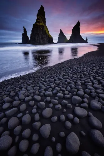 Reynisdrangar are basalt sea stacks situated under the mountain Reynisfjall near the village Vík í Mýrdal, southern Iceland which is framed by a black sand beach that was ranked in 1991 as one of the 