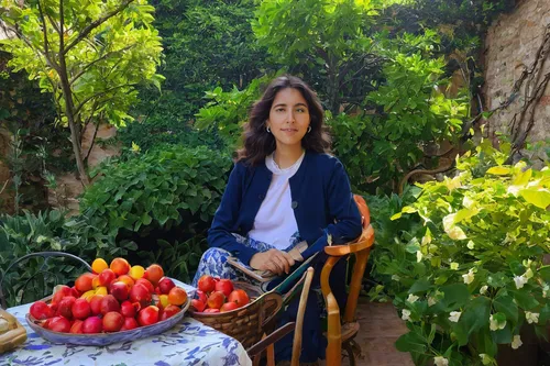 Gabriela Quezada is in a peaceful garden, feeling content and inspired. Write a poem about her experience.,provencal life,pluot,tamarillo,mirabelles,menemen,garden breakfast,plums,bowl of fruit in rai