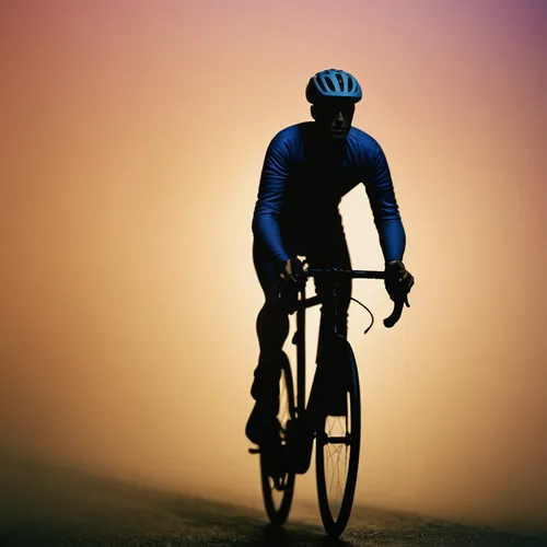 Cyclist in the mist,bicycle clothing,cyclist,bicycle lighting,bicycle jersey,endurance sports,road bicycle racing,road cycling,cycle sport,bike lamp,bicycle racing,artistic cycling,bicycle helmet,cass