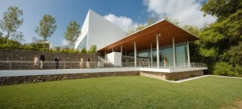 CESPED,a house is surrounded by trees and grass,cubic house,glass facade,glucksman,siza,structural glass,cube house