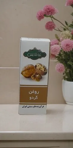 In a bathroom table,a box of pastry sits on a table,yemenidjian,bahraini gold,persian norooz,asafoetida,commercial packaging,hamoodi