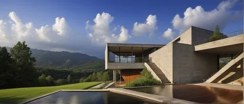 an award-winning villa, inspired by Tadao Ando's signature minimalist style. Lush greenery surrounds the villa, with clean lines and geometric shapes echoing throughout the architecture. Think expansi