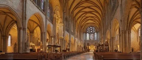 Romanesque architecture, grand cathedral, intricate stone carvings, stained glass windows, ribbed vaults, clerestory windows, Latin cross floor plan, apse, nave, transept, detailed sculptures of saint