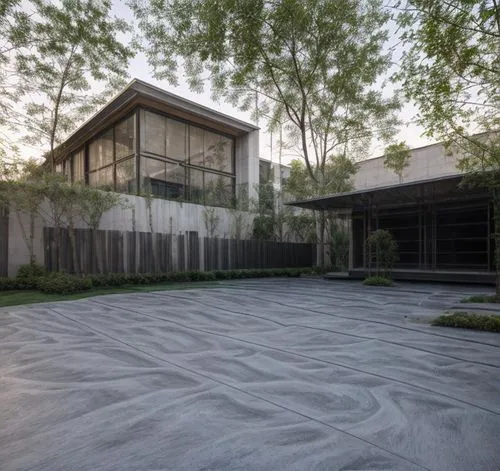 this large driveway has been made into a concrete area,zen garden,metaldyne,japanese zen garden,cube house,ceramic floor tile,landscape designers sydney,Architecture,Commercial Residential,Modern,Mexi