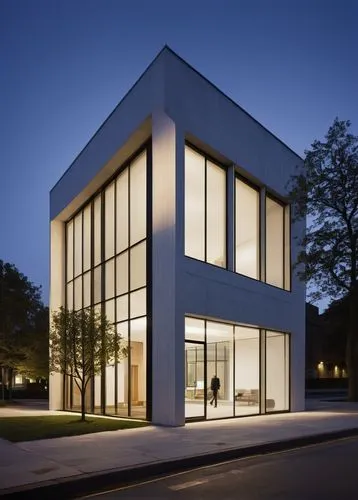 Frampton Kennett, modern architecture, solo building, white concrete walls, large glass windows, minimalist design, simple lines, geometric shapes, urban setting, cityscape, evening time, warm lightin