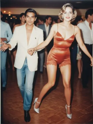 Grand beauty on the dance floor. Her lover behind.,a man and woman holding hands while dancing together,cantoral,danceteria,salsoul,lambada,bailar,charanga,Photography,Documentary Photography,Document