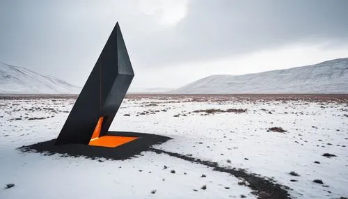 a geometric shaped monolith in a desolate landscape. floating above the ground. orange glowing edges. black steel. weathered material. alien portal,large triangular piece in the middle of a snow cover