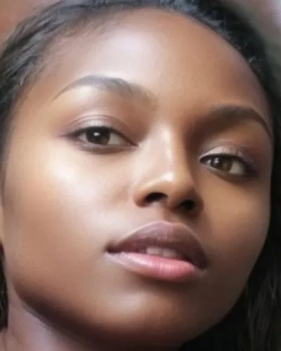 close up of an african american woman with long hair,hyperpigmentation,rwandan,beautiful african american women,monifa,colorism,juvederm