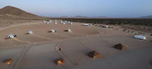 white geodesic dome tents with a small glass opening to see the sun ,wadirum,wadi rum,tamanrasset,kufra,bedouins,mastabas,cube stilt houses,timna park,libyan desert,semidesert,hadhrami,flaming mountai