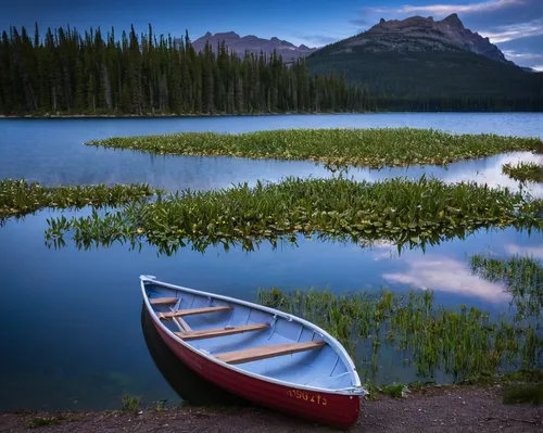 Row Boat on Baron Lake Long Exposure by suezyg2345 - Lakes And Reflections Photo Contest,maligne lake,bow lake,swiftcurrent lake,jasper national park,canadian rockies,vermilion lakes,banff national pa