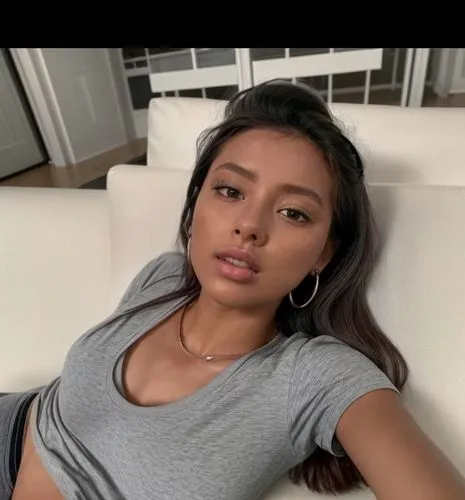 You can see her whole body.  She is lying at home on the sofa.  Lazy lying position.  She wears gray shorts and a shirt.,taraji,nurfaizi,topalli,filipino,liliyana,filipina,eurasian,uhura,benz,kisselev