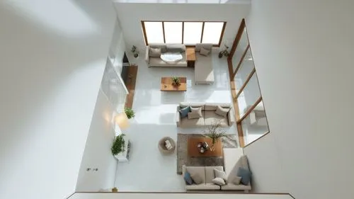 This is the living room. The floor is made of porcelain, the walls are white painted, and the windows are made of glass. There are sofas,circular staircase,winding staircase,skylights,outside staircas