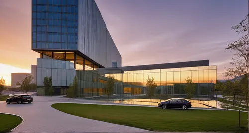 business center in Almaty ,mclaren automotive,glass facade,mercedes-benz museum,autostadt wolfsburg,mercedes museum,glass facades,corporate headquarters,lincoln motor company,glass building,chanceller