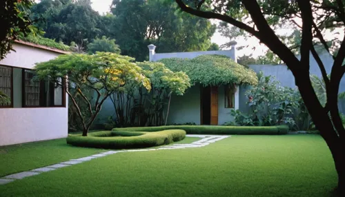 Paint a picture of tranquility in a garden on Mango Street.,green lawn,artificial grass,grass roof,turf roof,green garden,lawn,golf lawn,landscape designers sydney,mid century modern,green grass,mid c