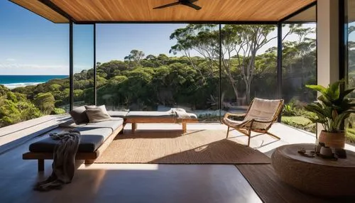 Byron Bay, Australia, modern coastal architecture, beach house, sustainable design, eco-friendly materials, wooden accents, large windows, sliding glass doors, open-plan living, minimalist decor, natu