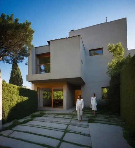 The sleek silhouette of a futuristic house is accentuated by the bold, thick hues of green contrasting against the fierce backdrop of a tall, earthy building. The streets below are dark and shrouded, 