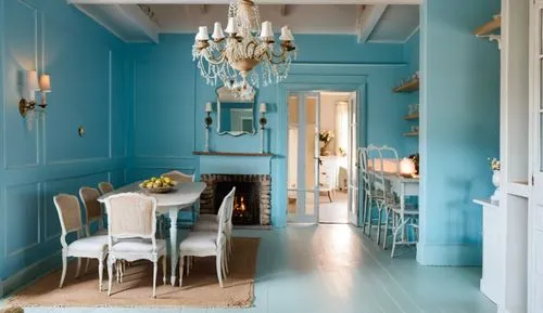 cozy dining room, classic wall panels, lots of details, chandelier, fireplace with fire, wall sconces. light floor, light-blue painted walls, interior decor, white doors,a dining room with light blue 